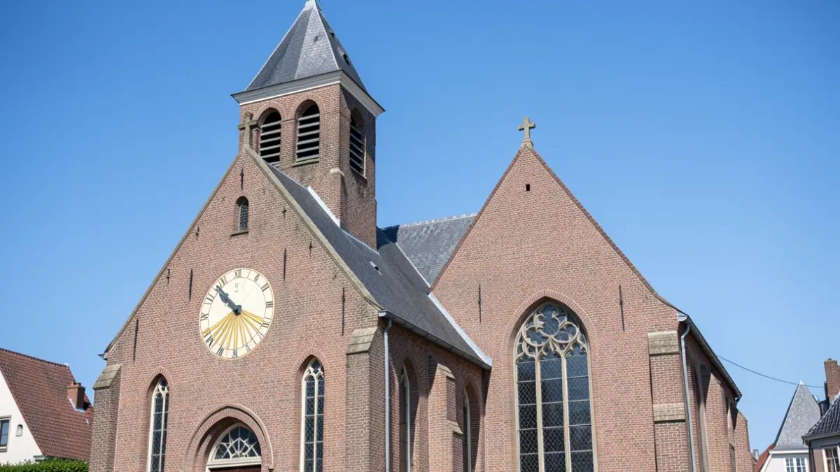 The Sint-Jan Baptist Church in Houthulst with the restored sundial.