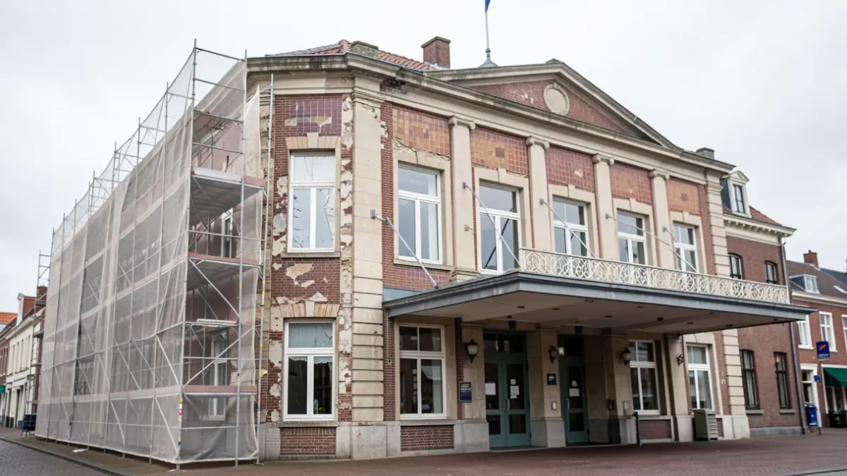 The facade of the Casino building in Blankenberge, Belgium, with temporary safety measures including debris netting and a protective canopy.
